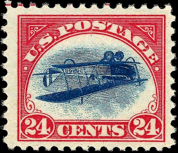 U.S. postage stamp with the "Inverted Jenny", an upside-down biplane.