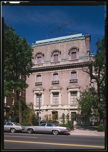 The facade of the Pullman house above 16th street with a car in front of it