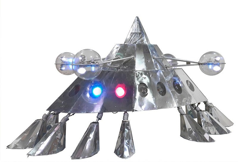 The Mothership stage prop, a silver spaceship with eight legs and lights. Source: The Smithsonian