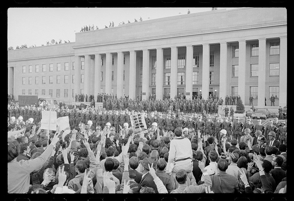 Large crowd of anti-Vietnam War protesters and military police in front of the Pentagon during the March on the Pentagon