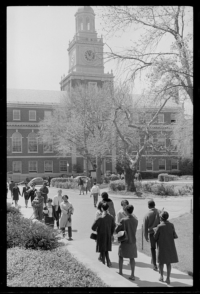 Students pictured walking in front of Founder's Library on the campus of Howard University.