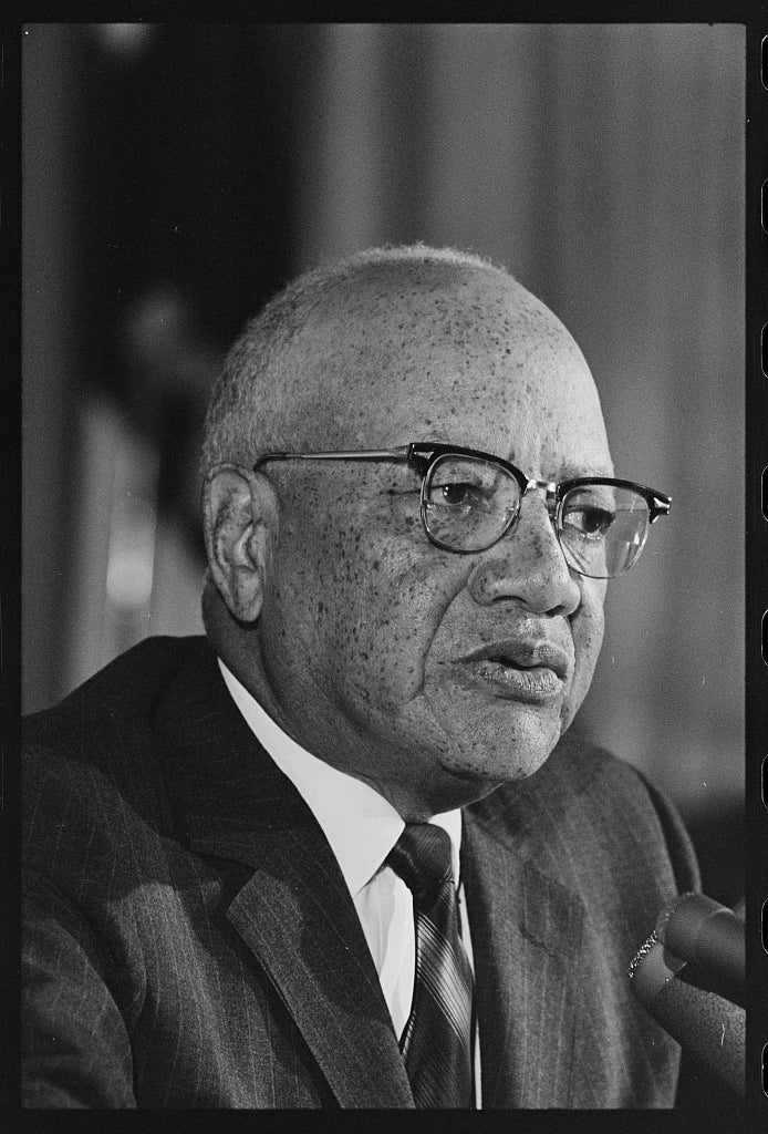 President Nabrit, pictured in suit and glasses, at a 1967 press conference. 