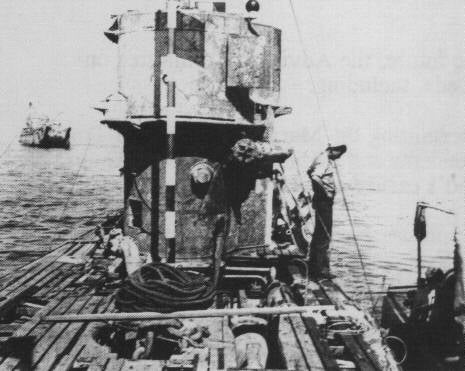 Black and white photo of Nazi U-Boat at surface after World War II.