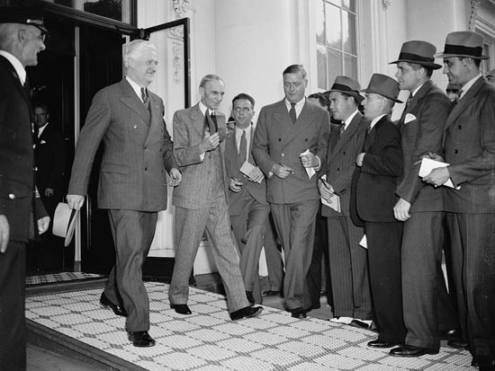 Henry Ford and his entourage leave the White House after their meeting with President Roosevelt, April 27, 1938. (Source: Library of Congress)