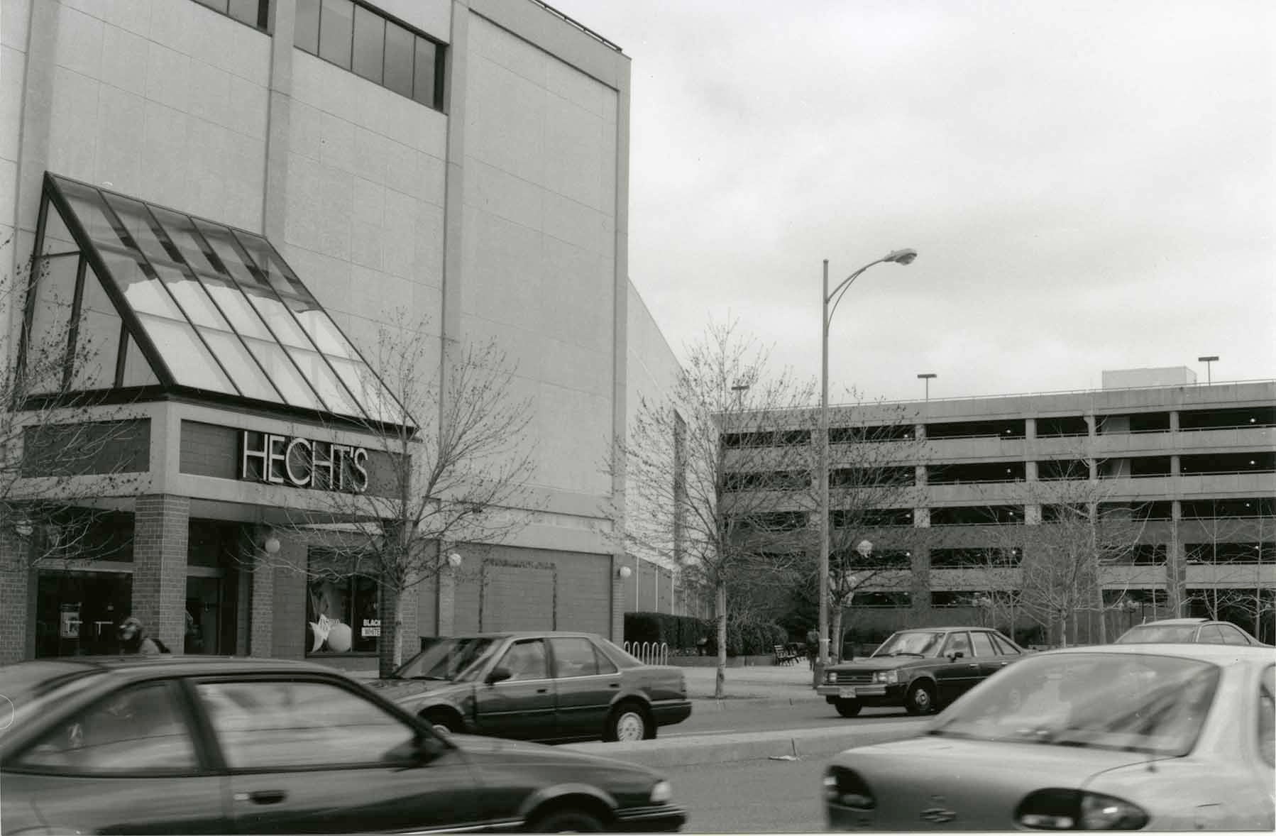 Exterior shot of Hecht's at Ballston Common and the renovated parking garage in 1996. (Photo courtesy of Arlington Public Library Center for Local History)Advertisement to meet Zippy the Chimp from the Evening Star. (Reprinted with permission of the DC Public Library, Star Collection (c) Washington Post) Exterior shot of Hecht's at Ballston Common and the renovated parking garage in 1996. (Photo courtesy of Arlington Public Library Center for Local History)