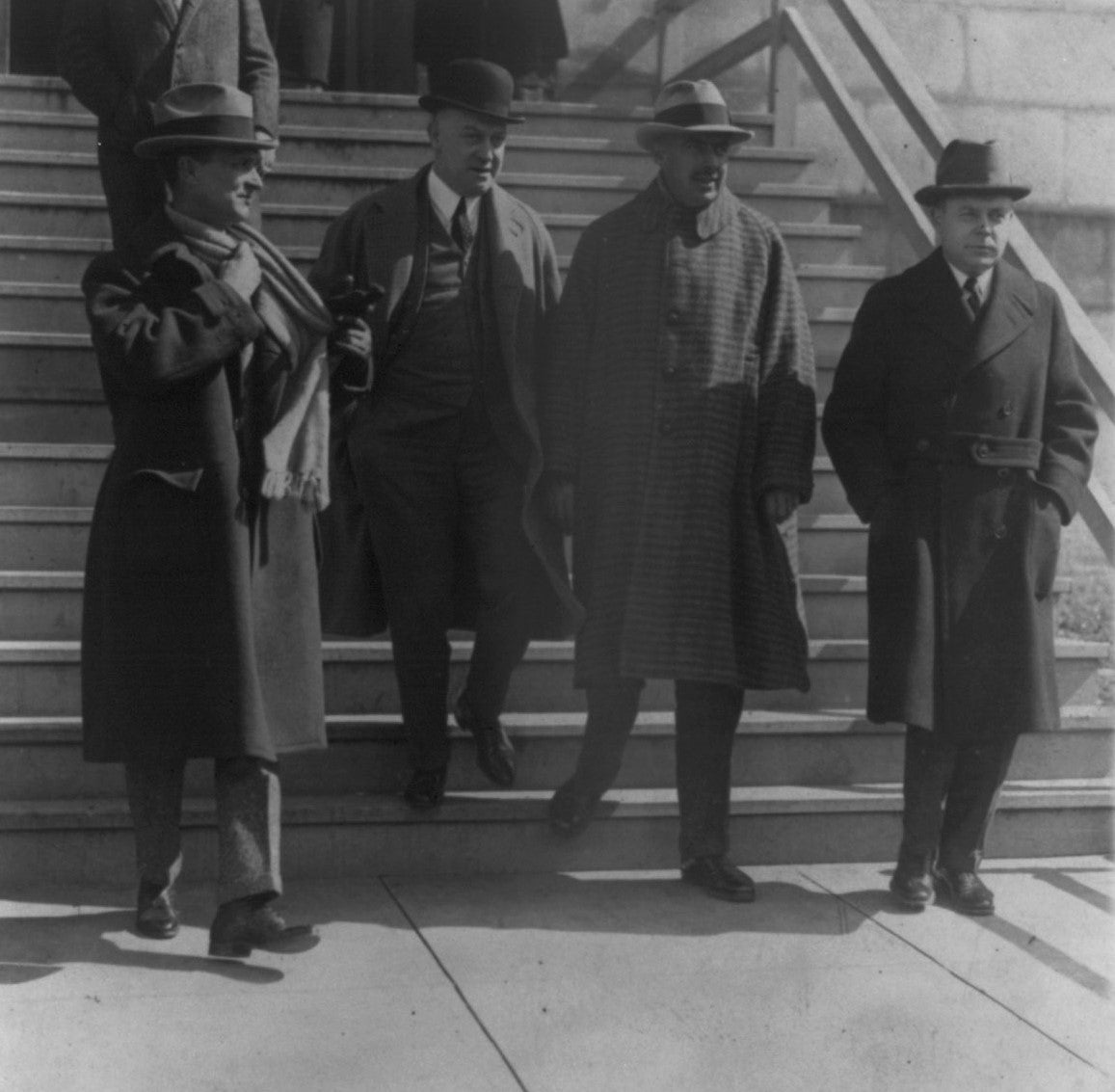 Ned McLean leaves the Capitol Building with his lawyers