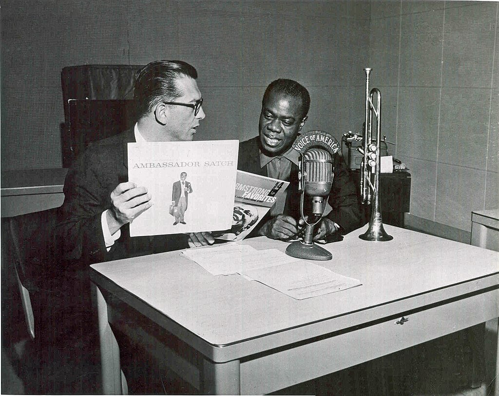 Willis Conover interviews Louis Armstrong for Jazz Hour on the "Music U.S.A." broadcast. Source: Wikimedia Commons Willis Conover interviews Louis Armstrong for Jazz Hour on the "Music U.S.A." broadcast. Source: Wikimedia Commons