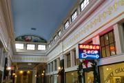 Interior of Chevy Chase Arcade showing shops.