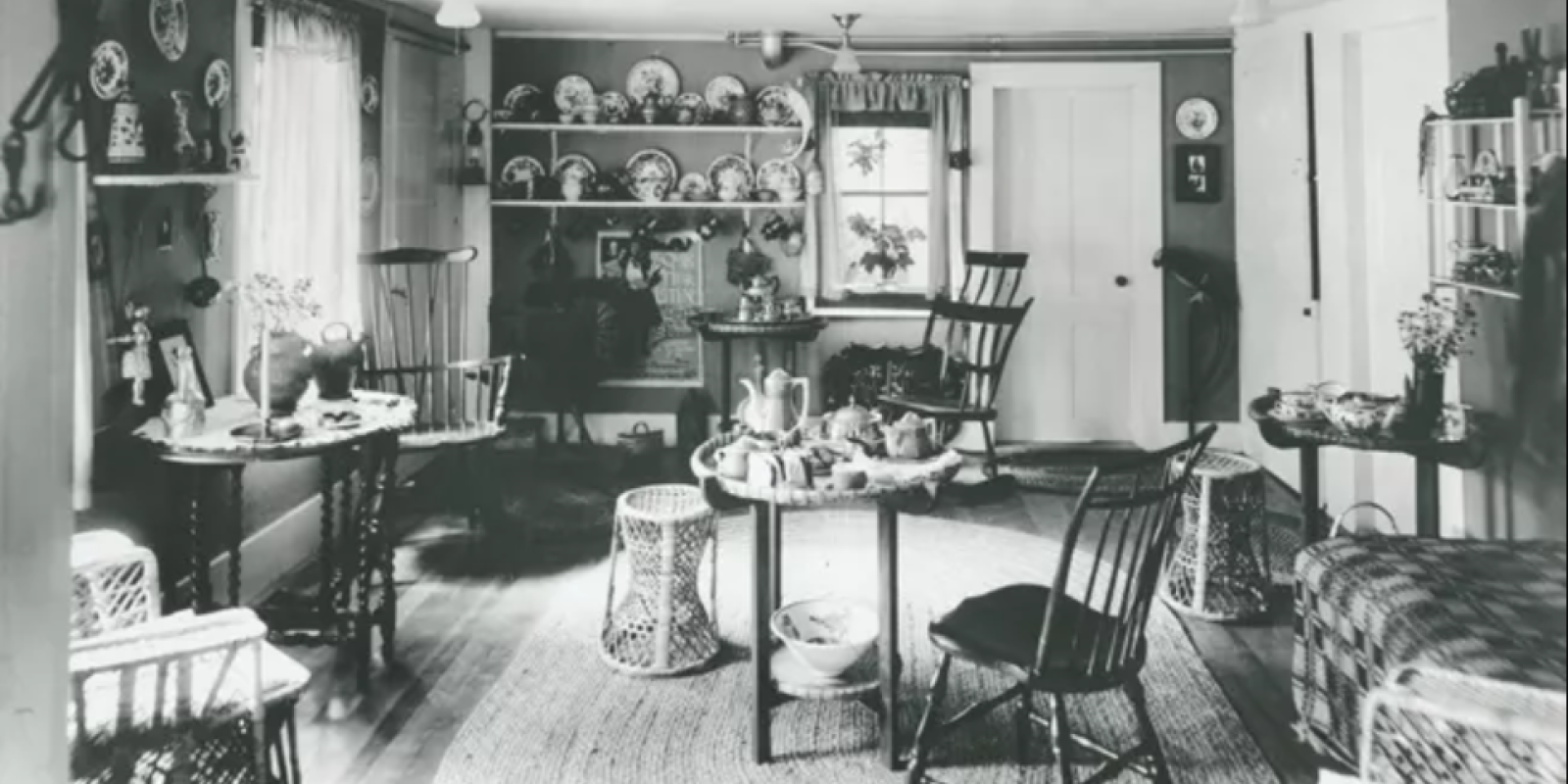 The interior of a historic teahouse with chairs, tables, and decorations