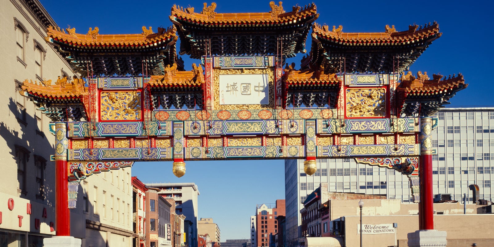 Chinatown arch in Washington DC against a blue sky.