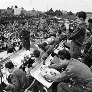 Glenn Miller’s band plays for US and Allied troops in England, Jun-Dec 1944. (Photo Source: U.S. Air Force, Public Domain) http://www.nationalmuseum.af.mil/Visit/Museum-Exhibits/Fact-Sheets/Display/Article/196150/maj-glenn-miller-army-air-force-band/
