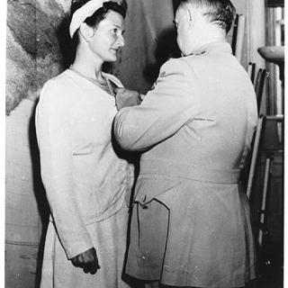 Virginia Hall receiving the Distinguished Service Cross (the second highest military honor given by the American government and the highest award a civilian can receive) by the head of the OSS, William Donovan.