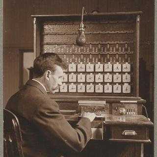 A census worker operating a Hollerith machine in 1908