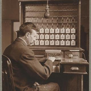 A census worker operating a Hollerith machine in 1908