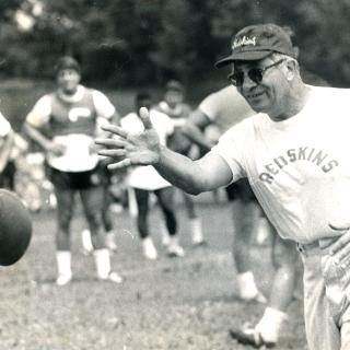 Vince Lombardi tosses a football in a practice during the 1969 season. (Reprinted with permission of the DC Public Library, Star Collection, © Washington Post.)