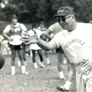 Vince Lombardi tosses a football in a practice during the 1969 season. (Reprinted with permission of the DC Public Library, Star Collection, © Washington Post.)