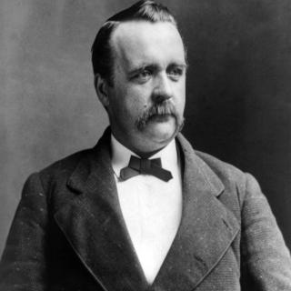 Black and white portrait photo of Justus H. Rathbone. 