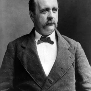 Black and white portrait photo of Justus H. Rathbone. 