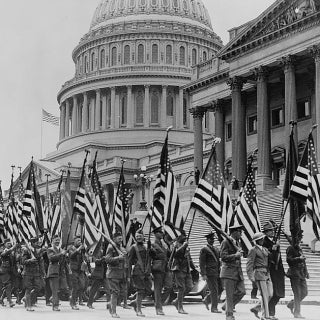Bonus marchers with flags in front of US Capitol in 1932. (Source: LIbrary of Congress)