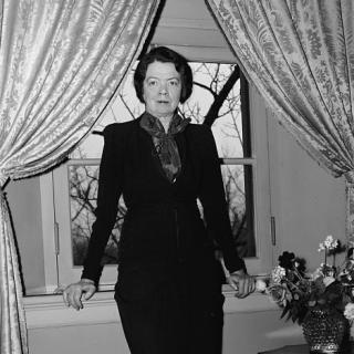 Cissy Patterson standing with her back to a window c. 1939. (Source: Library of Congress)