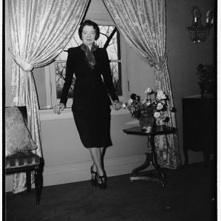 Cissy Patterson standing with her back to a window c. 1939. (Source: Library of Congress)