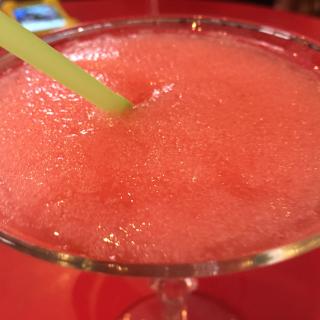Closeup of red frozen daquiri in glass with straw. (Source: Flickr user vxla, licensed by CC BY-NC 2.0)