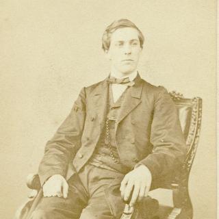 David Homer Bates sitting in chair, 1865. (Source: Library of Congress)