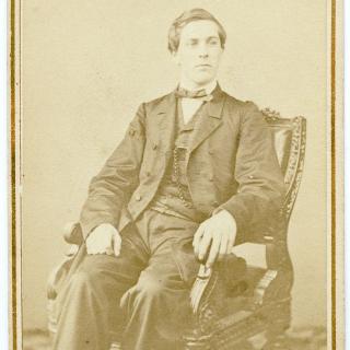 David Homer Bates sitting in chair, 1865. (Source: Library of Congress)