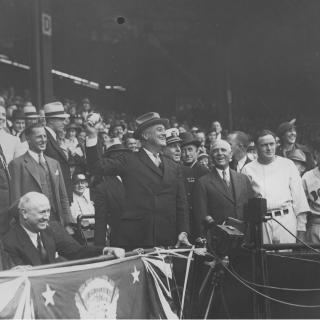 President Franklin D. Roosevelt throws out the first pitch at a 1934 baseball game between the Washington Senators and Boston Red Sox. (Source: National Archives)