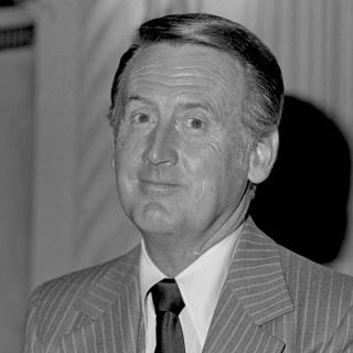 Vin Scully wearing suit and tie in 1979 (Source: UCLA via Wikimedia Commons. Cropped and used via CC-BY 4.0 license.))