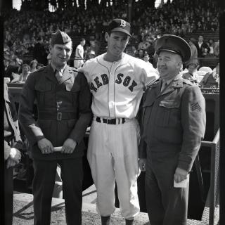 Boston Red Sox baseball player Ted Williams stands between two marines at Fenway Park on April 18, 1950. (Source: National Archives)