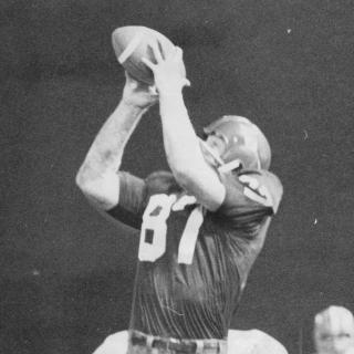 Jerry Smith jumps and reaches to catch a pass over his head during a September 1969 game.