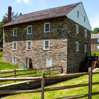 A modern photo of the exterior of the Peirce Mill, a three story brick building