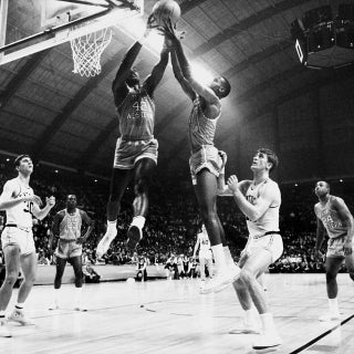 David Lattin (42) and a Texas Western teammate compete for control of a rebound as Kentucky's Tommy Kron, left, and Pat Riley , right, look on during the 1966 NCAA Photos via Getty Images Championship. Texas Western defeated Kentucky 72-65 for the championship title and was the first team to have an.. all-.black starting five compete in the NCAA Photos via Getty Images final. Rich Clarkson/NCAA Photos via Getty Images