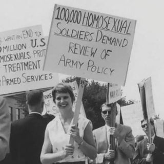 People protest for gay rights with picket signs outside the pentagon