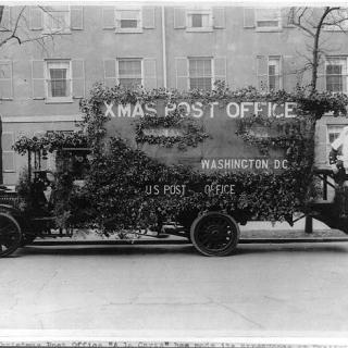 Postal truck in Washington decorated in an appeal for early mailing for the Christmas season, 1921. (Source: Library of Congress)