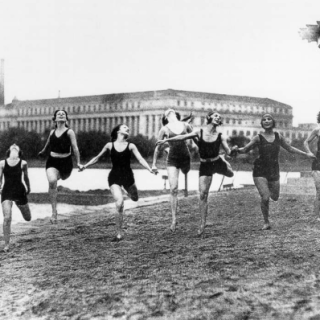 Women frolic on the shores of the Bathing Beach in 1920.