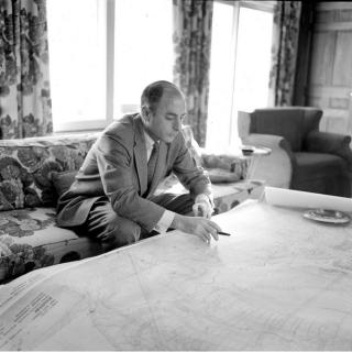Simon with plans of Reston, 1960 (Source: New York Times / The Reston Historic Trust and Archives)