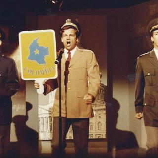 Three men on stage in costume