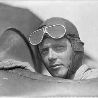 Charles Lindbergh, wearing helmet with goggles up, in open cockpit of airplane at Lambert Field, St. Louis, Missouri, 1923. (Source: Library of Congress)