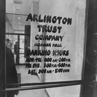 Bullet hole in the door of Arlington Trust Company bank in Crystal City, where the Tuller's crime spree began in 1972. (Reprinted with permission of DC Public Library, Star Collection © Washington Post)