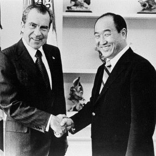 Richard Nixon shaking hands with Reverend Sun Myung Moon