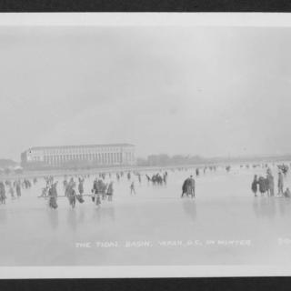 Black and white photo of people ice skating and walking on the Tidal Basin