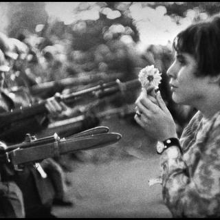 Jan Rose Kasmire, confronts National Guard troops during Vietnam War protest outside Pentagon on October 21, 1967 (Photo by Marc Riboud, licensed from Magnum Photos)