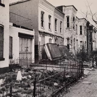 Row of rundown homes on 7th St SW