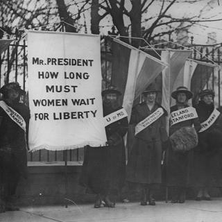 Women suffragists picketing in front of the White house on "College Day" in 1917. (Source: Wikipedia)