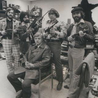 Lt. Robert Arscott and the Operation Sting team sit amid stolen goods