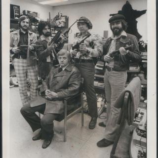 Lt. Robert Arscott and the Operation Sting team sit amid stolen goods