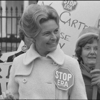 Phyllis Schlafly, wearing a "STOP ERA" badge, protesting the Equal Rights Amendment in front of the White House in February 1977.