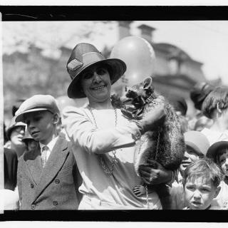 First Lady Grace Coolidge holds Rebecca the Raccoon